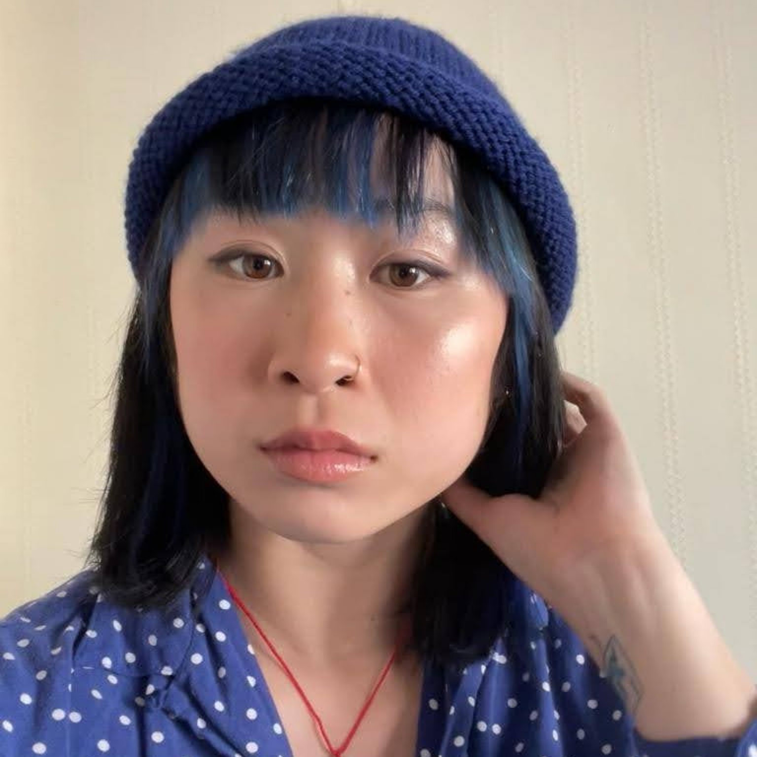 Mia in a roll brim beanie